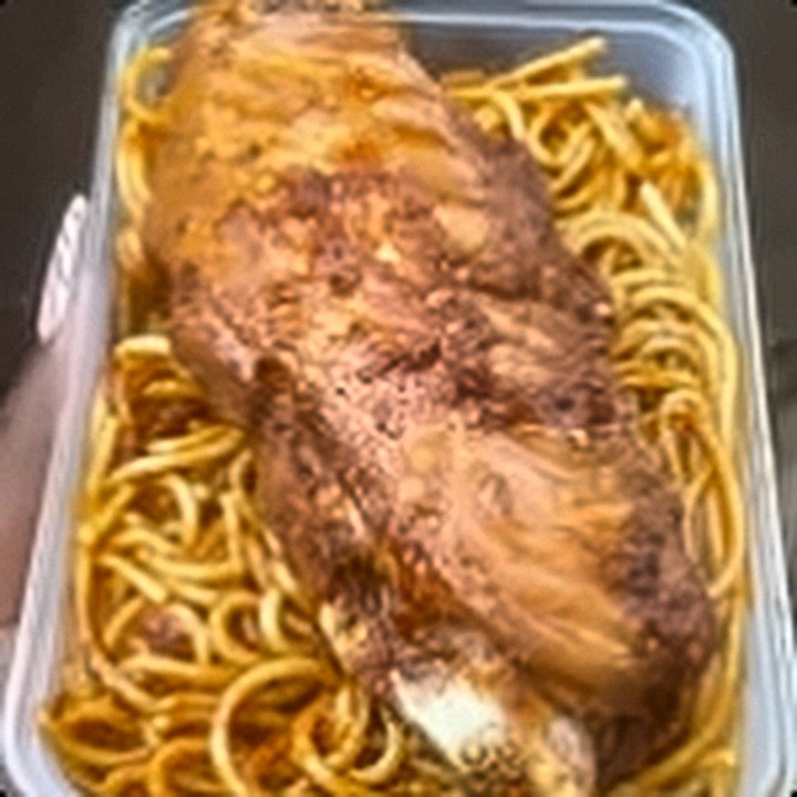 Jollof spaghetti with a whole turkey piece